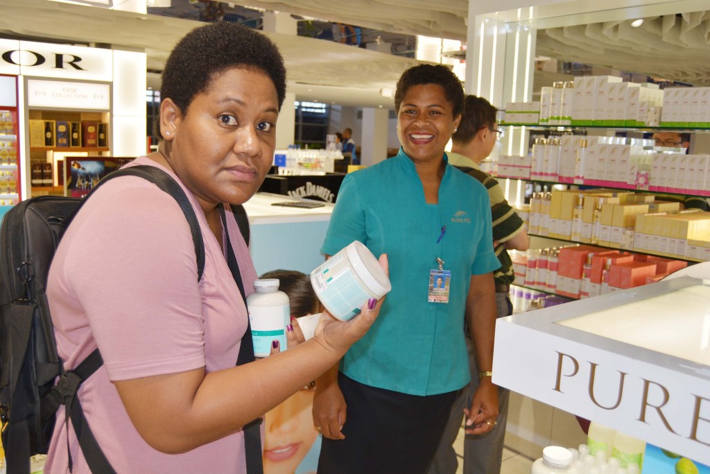 A customer goes through the range of Pure Fiji products at Prouds in